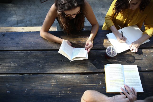 People studying and talking