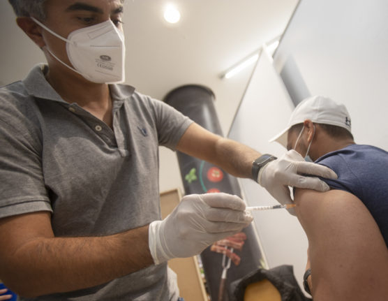 man vaccinated against covid wearing masks in austria
