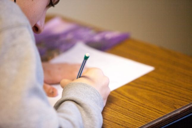 A pupil taking an exam, which could be scrapped in Norway.