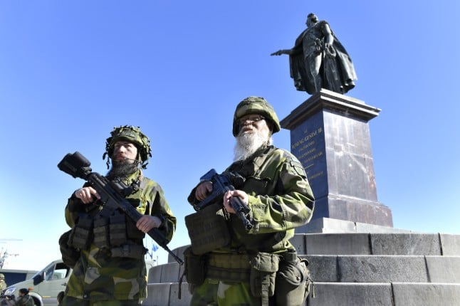 Soldiers from Sweden's Home Guard protest the Royal Palace in Stockholm during an exercise in 2018