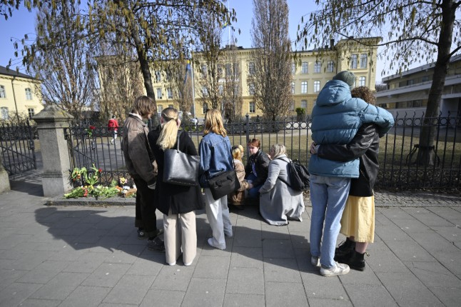Pupils hug outside Malmö Latin on Tuesday