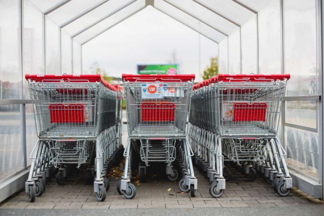 Shopping trolleys lined up at a German supermarket. Photo by Markus Spiske on Unsplash