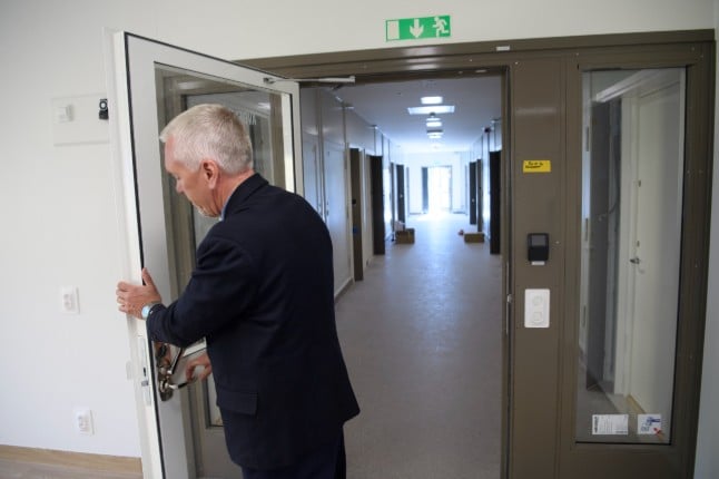 Prison warden Lars Widholm opens a door at Skenäs prison outside Norrköping