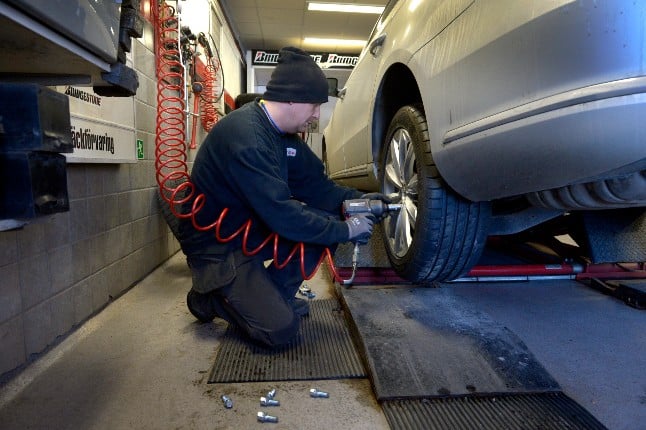 A worker changes a tyre at Haggströms Däck in Stockholm