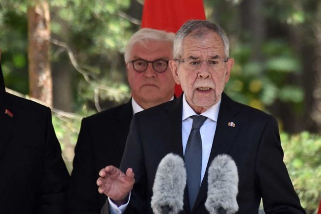 Austria's President Alexander Van der Bellen (R) delivers a speech as German President Frank-Walter Steinmeier (C) looks on during a ceremony to unveil a monument to the victims of World War II. Sergei GAPON / AFP