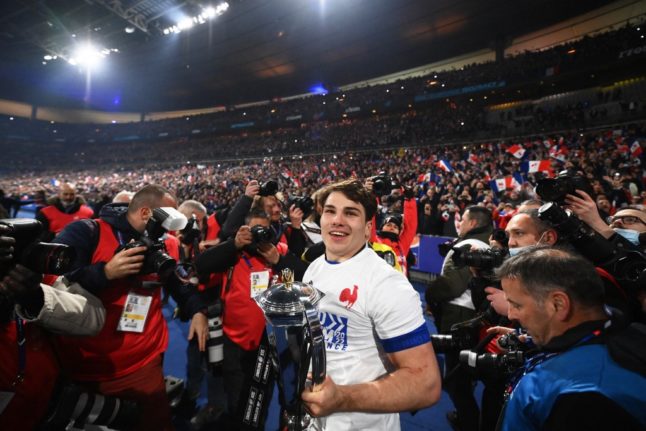 France's scrum-half Antoine Dupont celebrates after winning the 2022 Six Nations tournament.