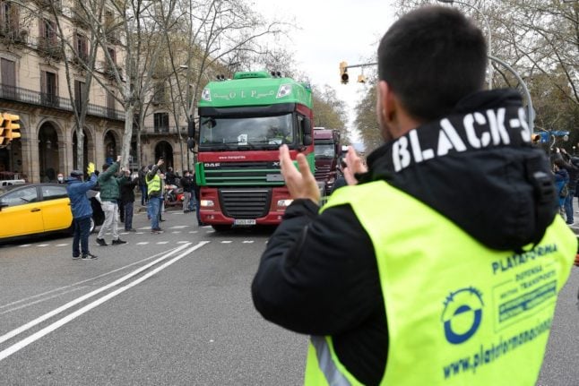 Spain's striking truckers halt stoppage 'for now'