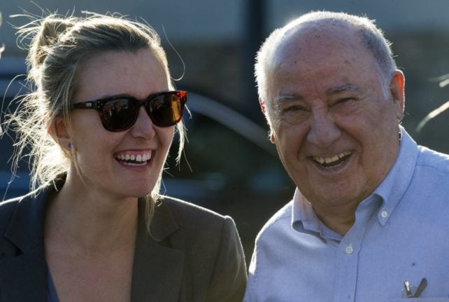 (FILES) In this file Founder and chairman of the Inditex fashion group Amancio Ortega (R) laughs with his daughter Marta Ortega. Photo taken July 31, 2016.