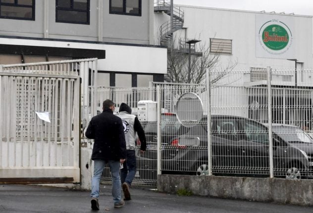 Employees arrive at the Buitoni factory in Caudry, northern France, which is the suspected source of an E.coli outbreak