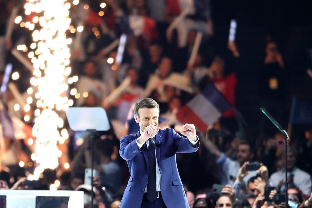 Emmanuel Macron greets supporters amid fireworks at first campaign rally