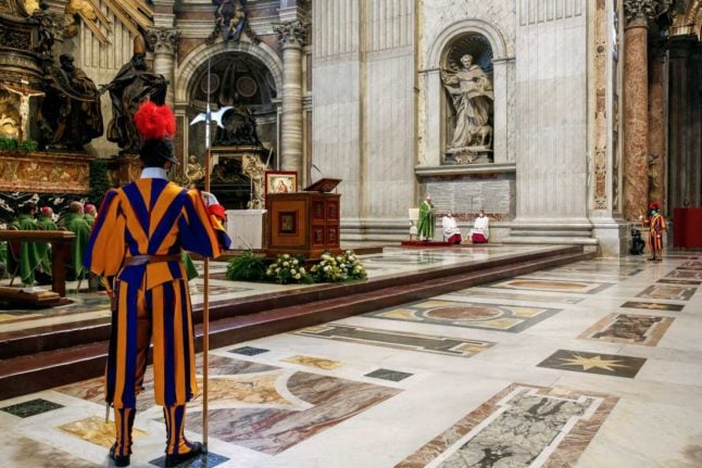 A Swiss guard at the Vatican in Rome. Photo: REMO CASILLI / POOL / AFP