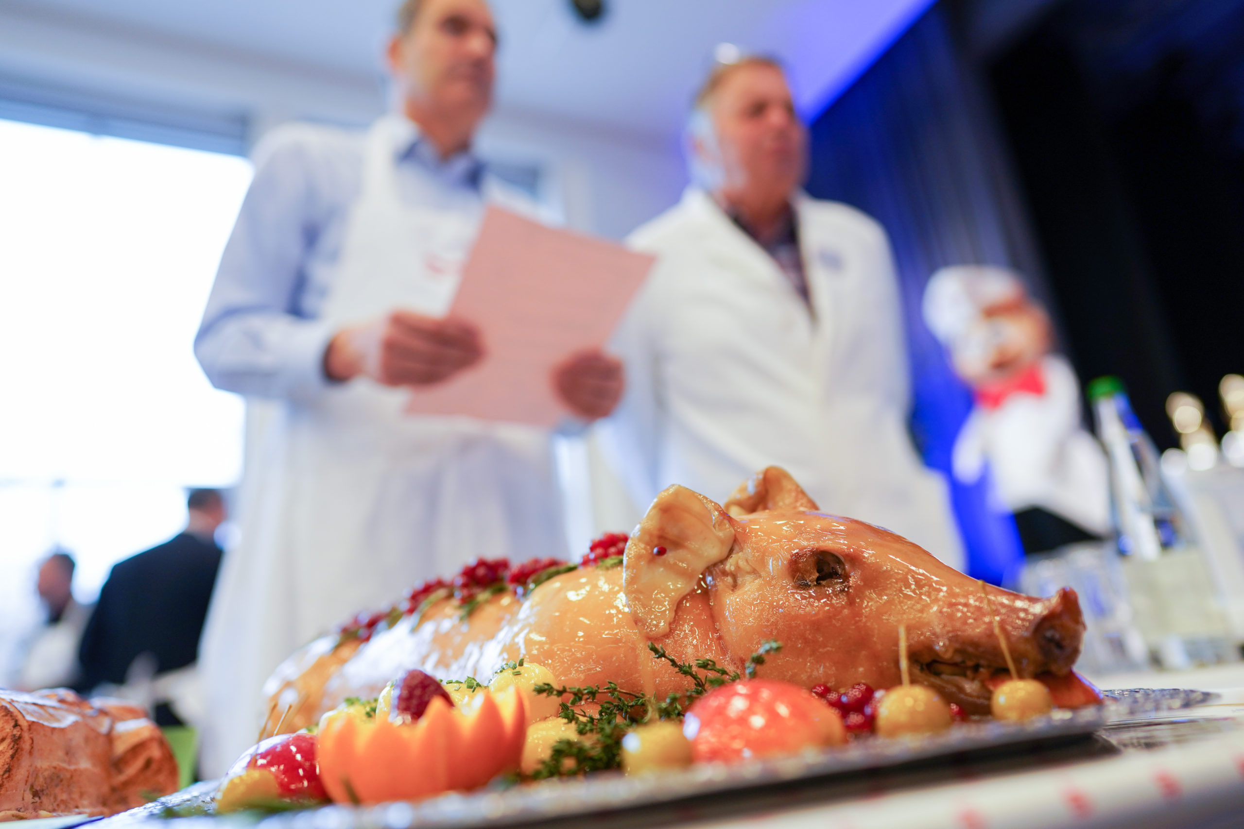 Judges examine a pig-shaped Saumagen at a Saumagen cooking competition in Herxheim