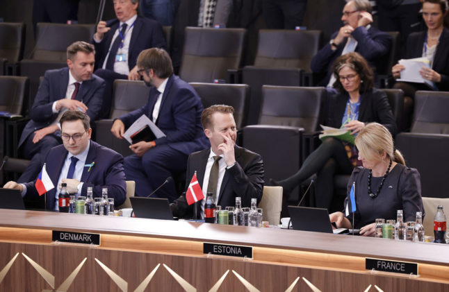 Denmark's Foreign Minister Jeppe Kofod, center, speaks with Estonia's Foreign Minister Eva-Maria Liimets, right, during a meeting of NATO foreign ministers at NATO in Brussels on April 7th 2022.