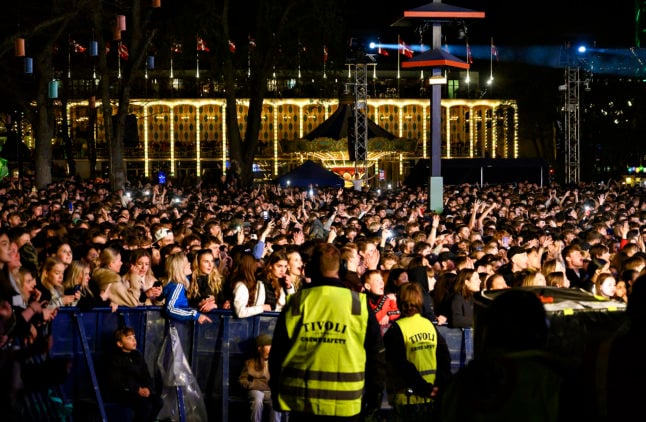 Crowds watching Danish Andreas Odbjerg in Tivoli garden during Friday Rock on 22 April 2022.