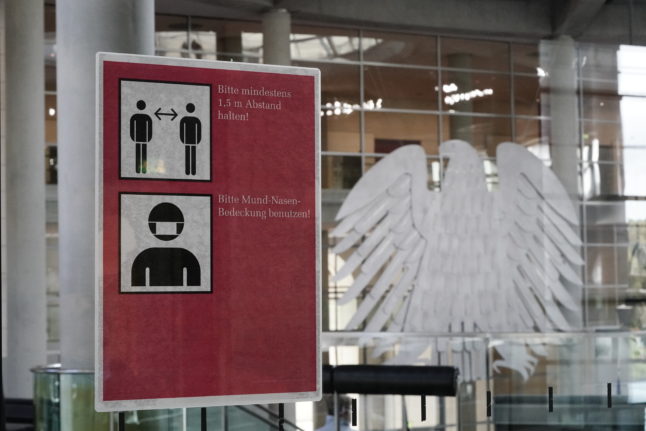 A sign informing MPs of Covid rules in the German Bundestag.