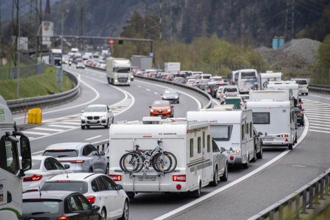 Travel traffic in front of the Gotthard tunnel southbound between Amsteg and Erstfeld.