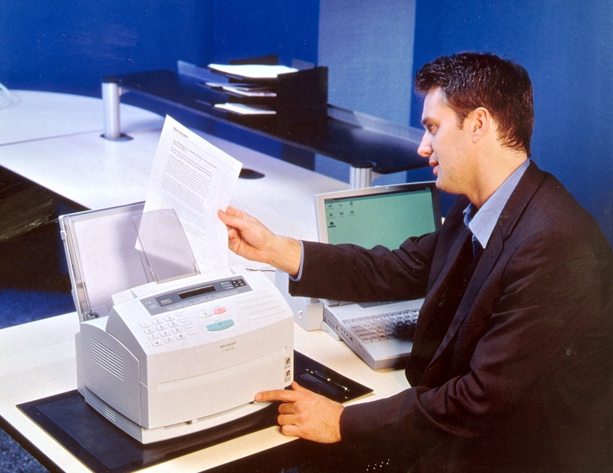 A man with a fax machine