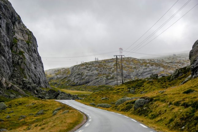 A road and power line in Norway.