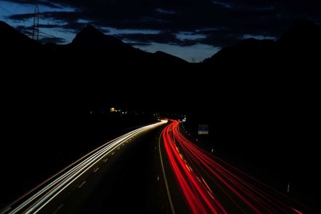 People drive along a highway outside of Zurich, Switzerland. Photo by Jose De Queiroz on Unsplash