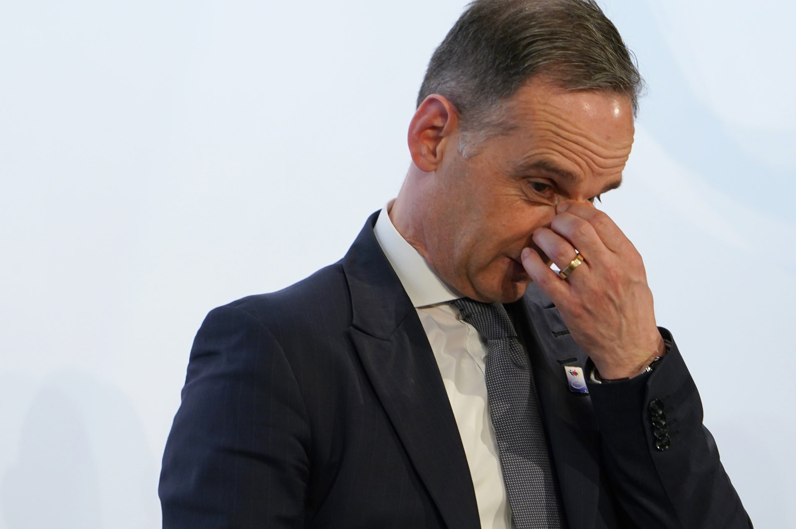 Heiko Maas (SPD), Federal Minister of Foreign Affairs, holds his nose during a press conference. 