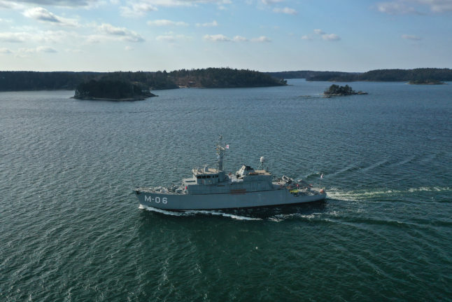 NATO ship on its way through the Stockholm archipelago after the visit to Stockholm.