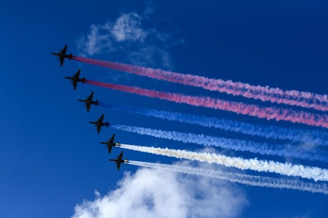 Russian Sukhoi Su-25 assault aircrafts release smoke in the colours of the Russian flag while flying over Moscow during a rehearsal for the WWII Victory Parade.