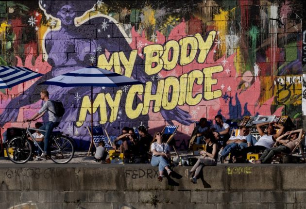 People enjoying the sun at the Danube canal in Vienna, Austria on Thursday May 5