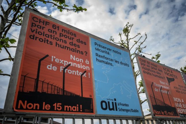 Electoral signs for and against a referendum challenging plans to increase Switzerland’s contribution to the European border agency Frontex