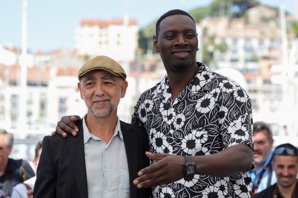French director Mathieu Vadepied (L) and French actor and comedian Omar Sy pose during a photo call for the film "Father And Soldier (Tirailleurs)" during the 75th edition of the Cannes Film Festival in Cannes, southern France, on May 19th, 2022. 