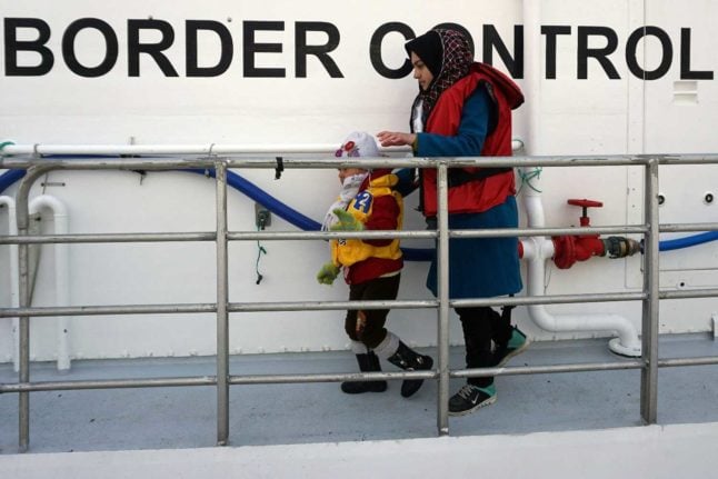 Two people on a Norwegian Frontex boat near the Greek island of Lesbos. Photo: STR / AFP