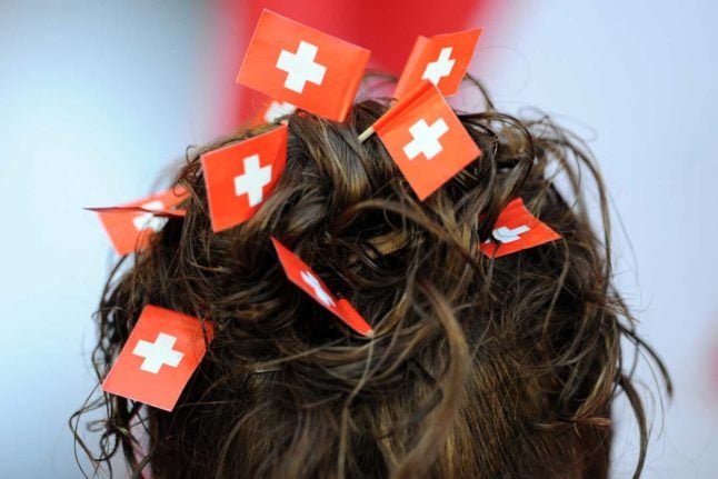 'If you're going to become Swiss, be sure to wear some flags in your hair' Photo: BORIS HORVAT / AFP