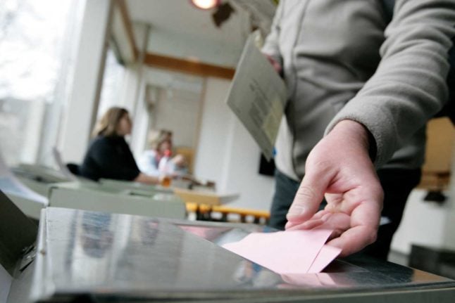 A voter casts their ballot in the Swiss canton of Zurich. Photo: SEBASTIAN DERUNGS / AFP