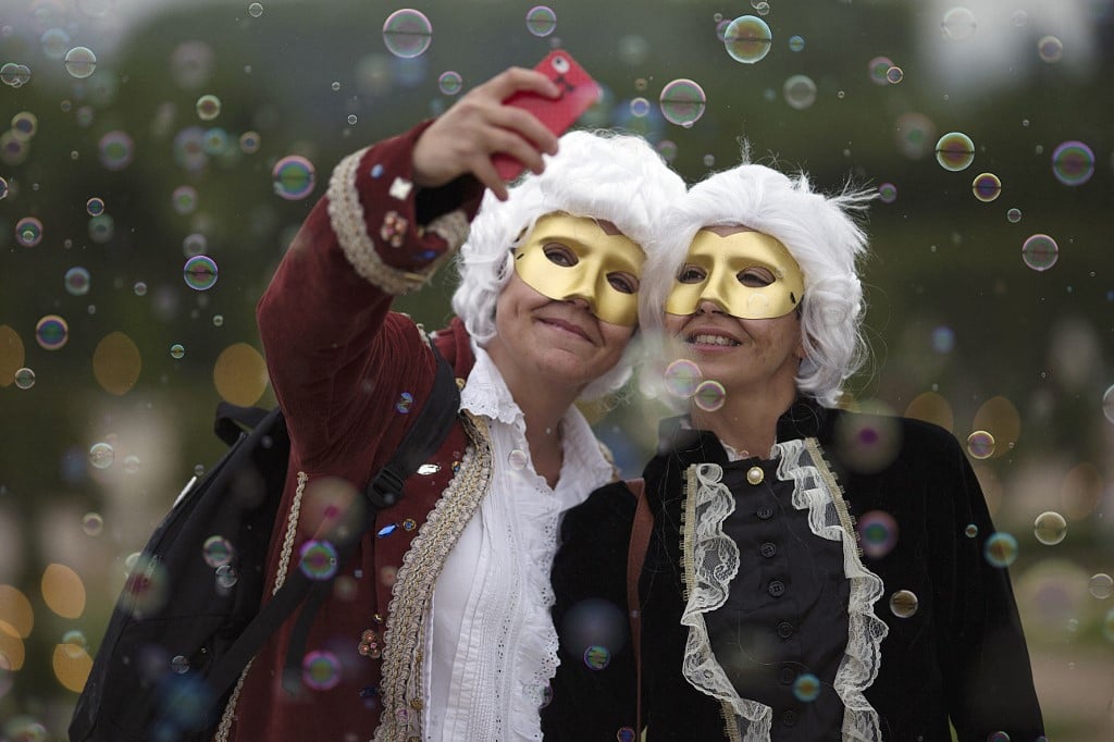 Revellers enjoy the masquerade ball in Versailles