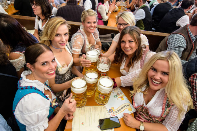 Revellers enjoy the Oktoberfest atmosphere  in September 2019. 