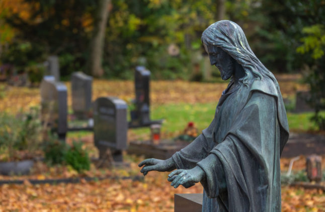 Foliage lies over graves at Trier's main cemetery on November 1st 2021 (All Saints' Day).