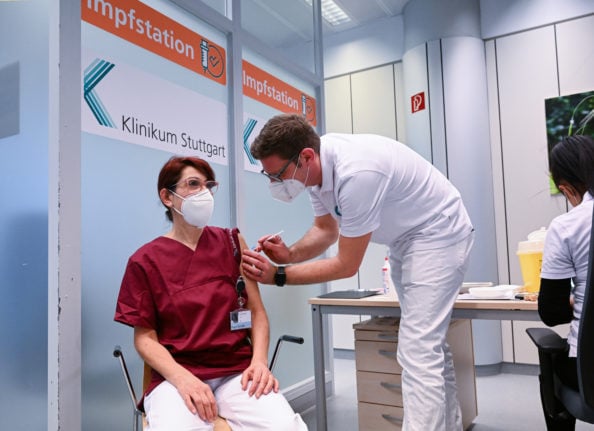 A health worker receiving a vaccination in Stuttgart.