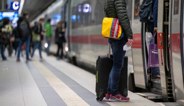 Passengers boarding a train in Berlin's main station.