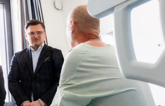 Dmytro Kuleba, Minister of Foreign Affairs of Ukraine, talks to a Ukrainian being treated in the surgery department of the University Hospital Schleswig-Holstein (UKSH)