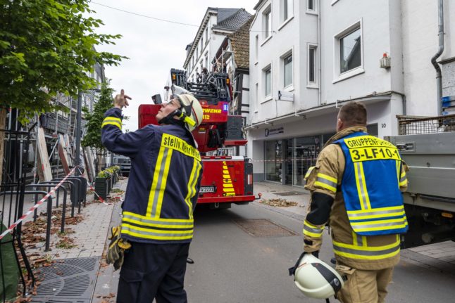 Firefighters secure houses and help to clean up the storm damage in Lippstadt, a day after a tornado hit, May 21st 2022.