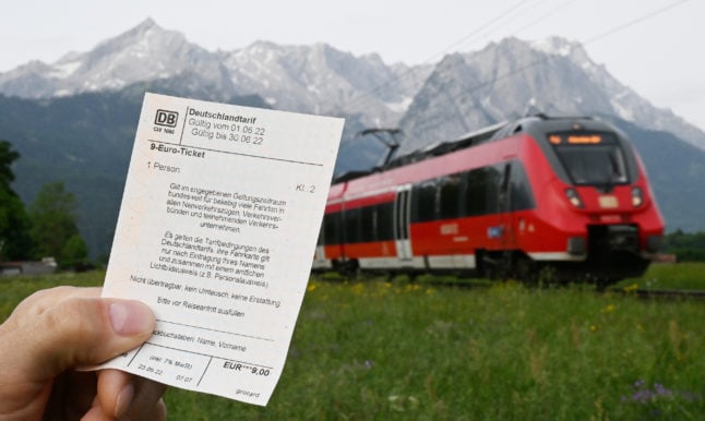 A passenger holds the €9 ticket in Garmisch-Partenkirchen, Bavaria.