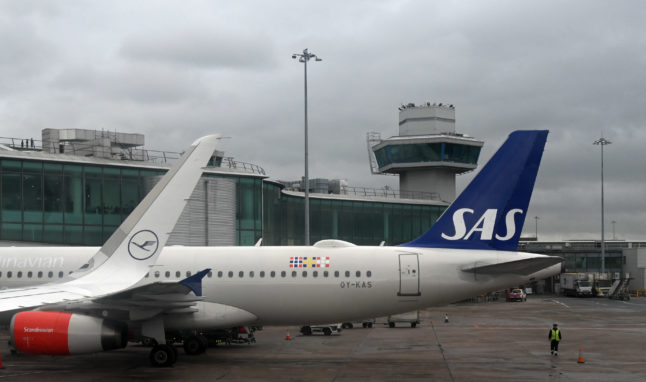 A SAS aircraft parked on the tarmac at Manchester Airport