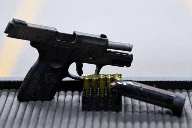 Pictured is a pistol at a gun club.