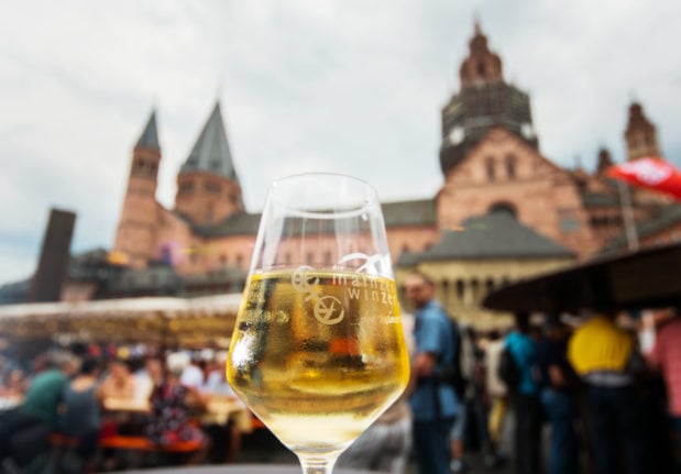 A glass of wine stands on a table near the cathedral in Mainz during the Johannisnacht festival in 2019 held in honour of Johannes Gutenberg.