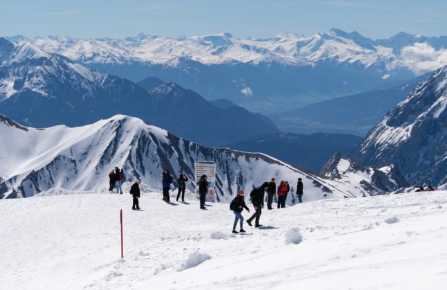 People enjoy stunning weather on the glacier at the Zugspitze in May 2021. 
