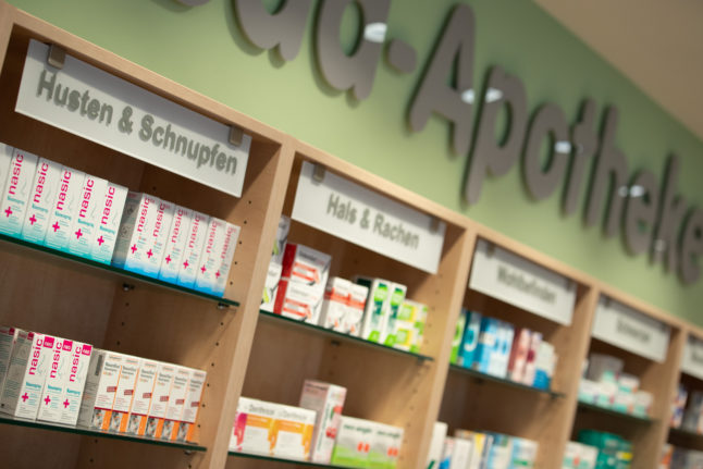 View of a shelf with medicines against coughs and colds in a pharmacy.