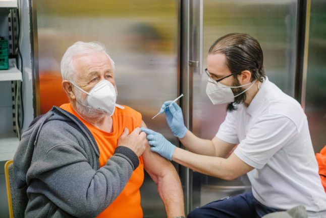 A man receives his second booster vaccination against Covid in Springe. Lower Saxony in February.