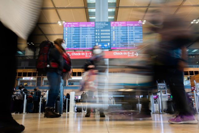 Passengers at Berlin airport in June.