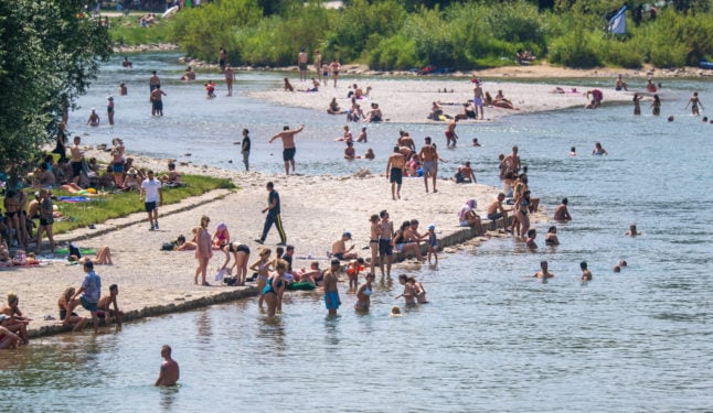 People cool down in the Isar river in Munich on Sunday.