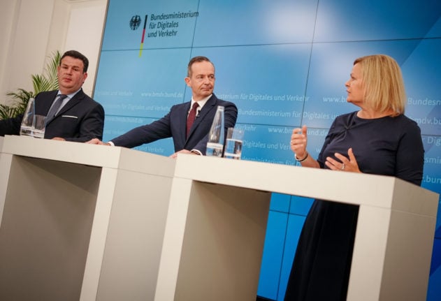 German government ministers Hubertus Heil, Volker Wissing and Nancy Faeser speak at a Berlin press conference on Wednesday.