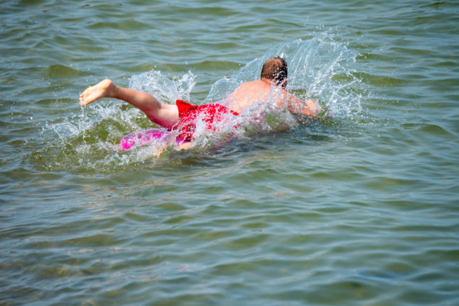 A man jumps in the sea in Zinnowitz on the island of Usedom.
